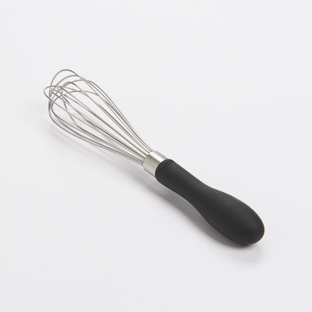 OXO garde plat op tafel, metalen draad en zwarte handgreep