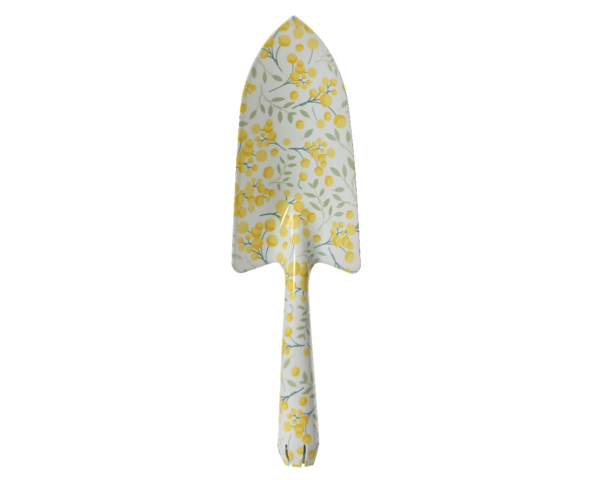 Metalen schep met witgele bloemenprint op blad en steel