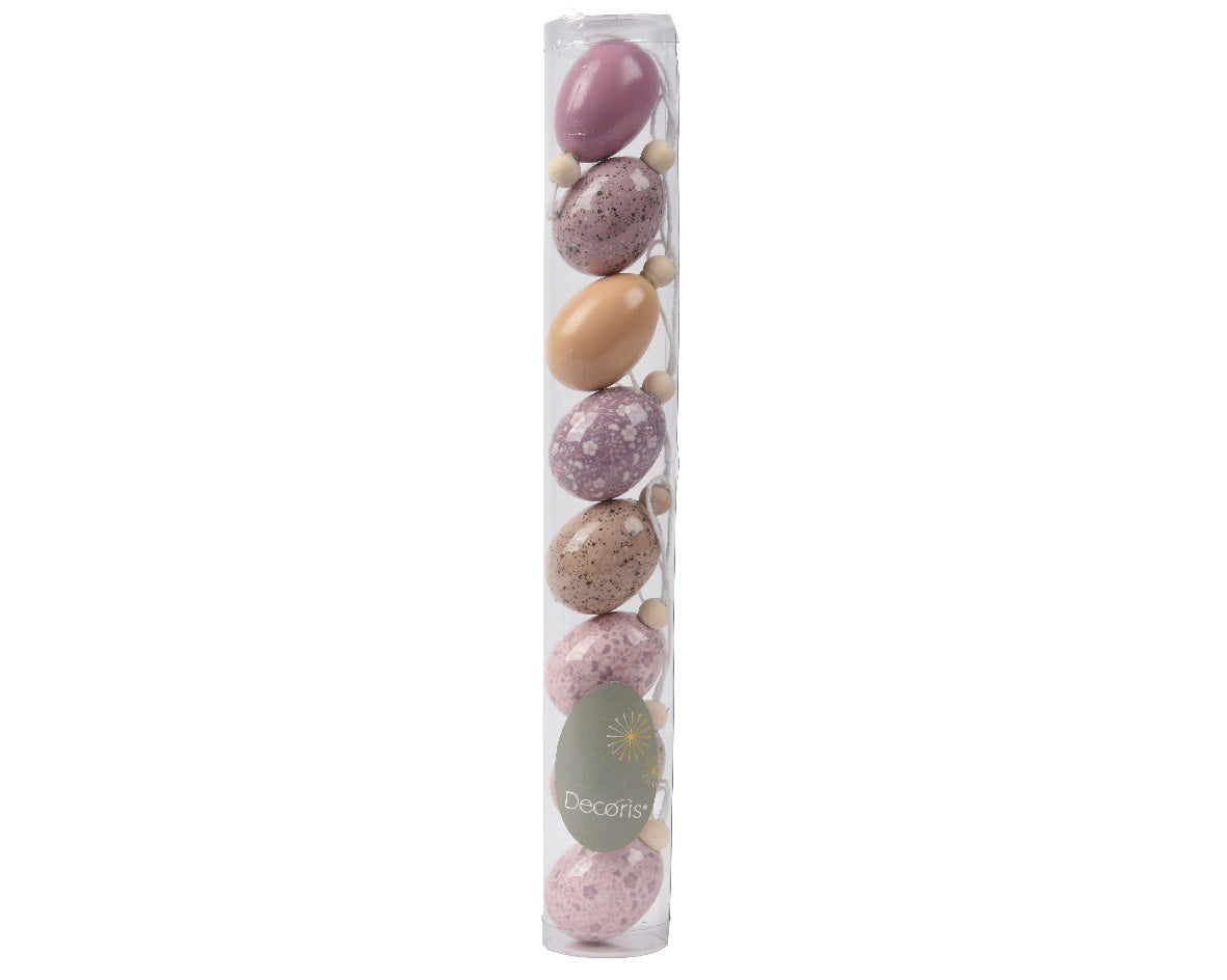 Assortiment schuim eieren in transparante koker, paarse en beige tinten