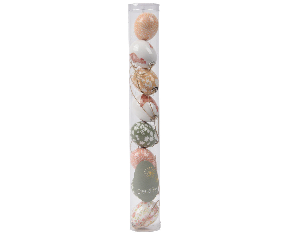 Assortiment schuim-eieren in transparante verpakking met pastel en patroon.