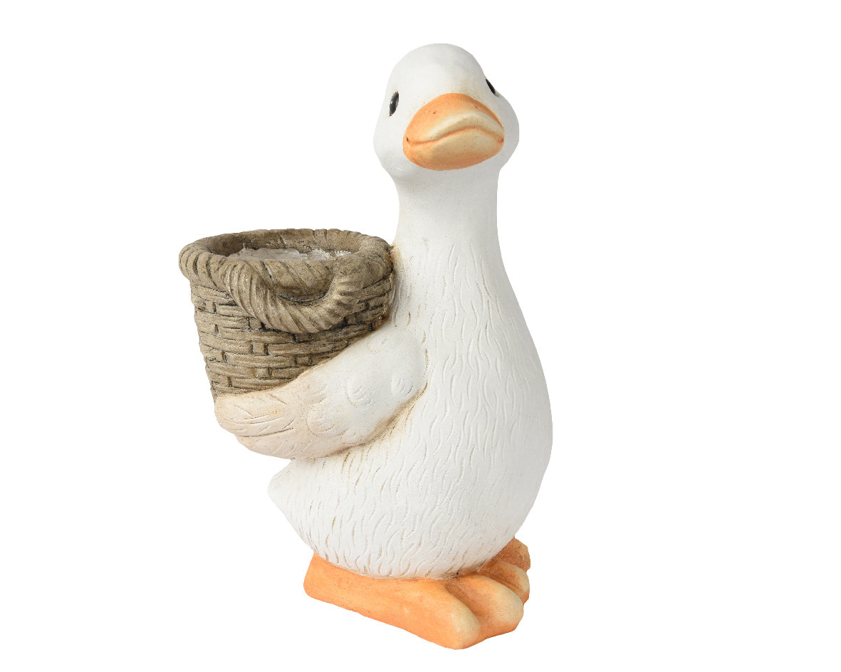 Witte eendfiguur met nestmandje van stro in de snavel