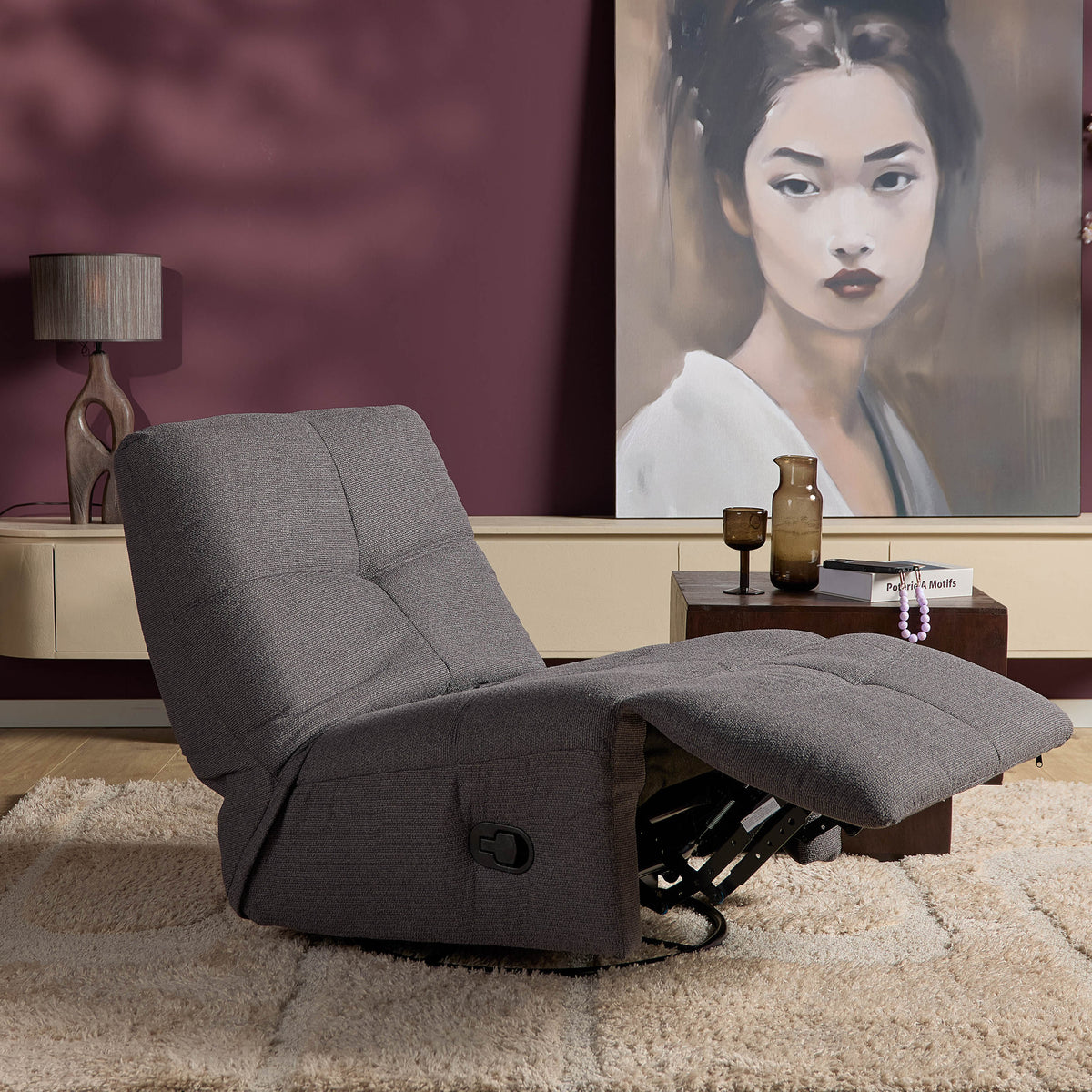 Donkergrijze relaxfauteuil met neerklapbare voetensteun en ronde armleuningen