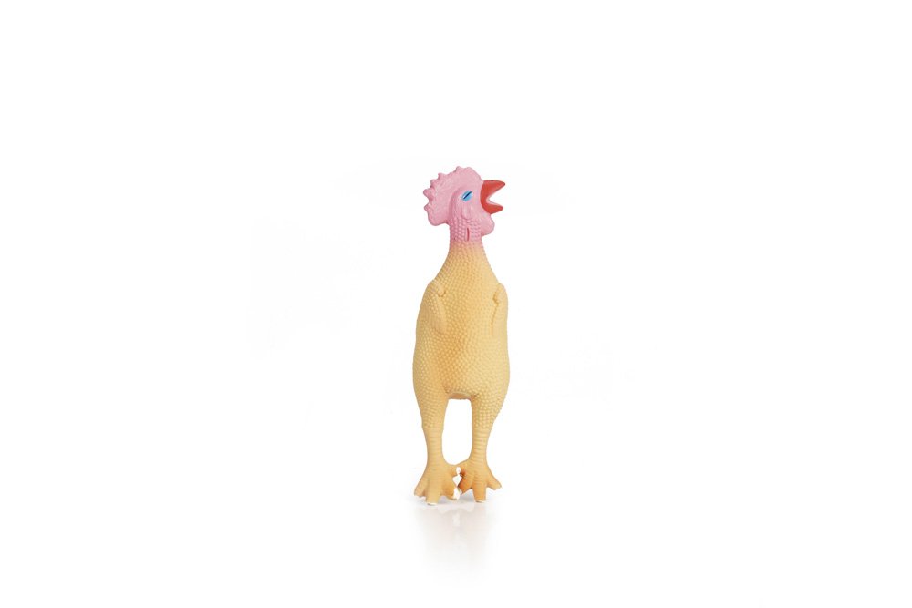Kleine knuffelkip met gele vacht, roze kop en oranje poten
