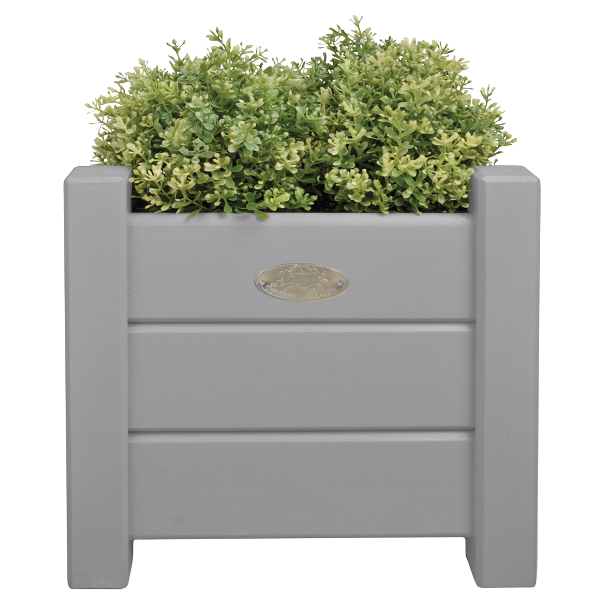 Vierkante grijze plantenbak met lamelzijden en bronzen muntje, gevuld met groen blad.