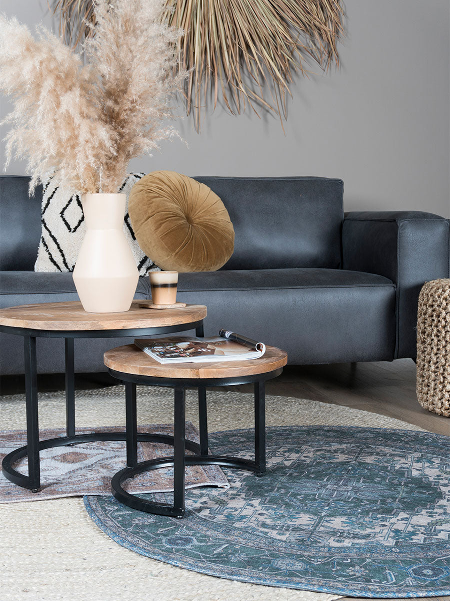 Rond vloerkleed met groenblauwe basis en beige geometrisch patroon, ø120 cm.