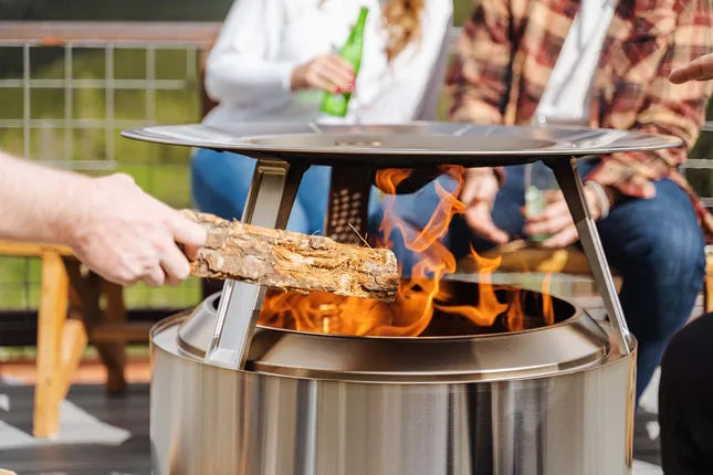 Metalen warmte deflector op Solo Stove Yukon, geperforeerde bovenplaat