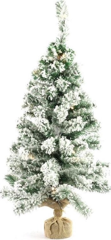 Witte kunstkerstboom met LED-lichtjes en witte decoratietakken, op stoffen voet