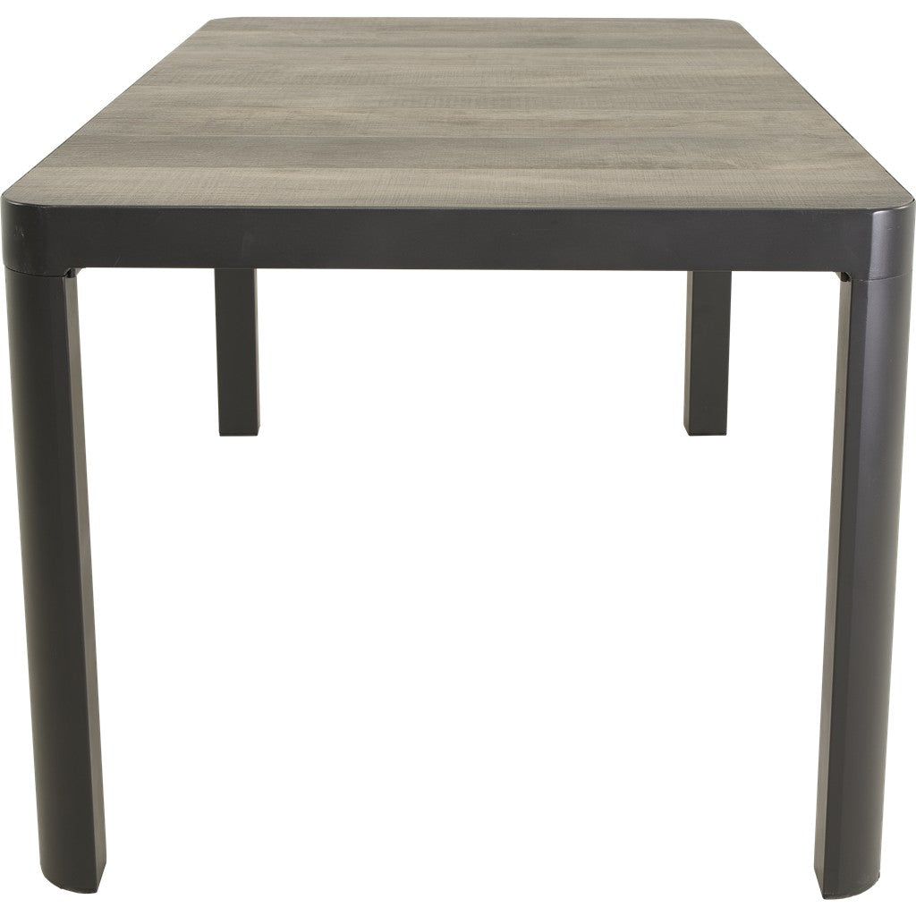 Zwarte eettafel met grijs houtnerf blad en donkere, taps toelopende poten