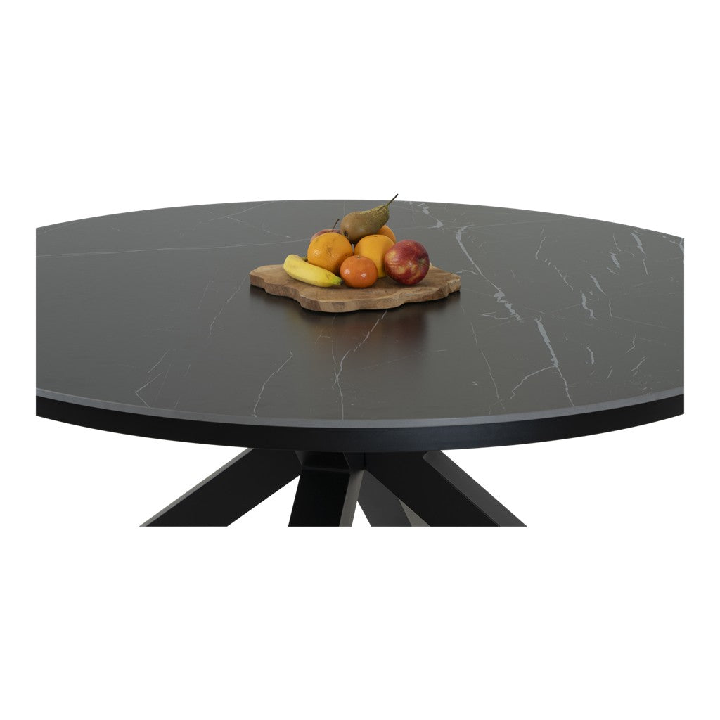 Ronde eettafel in donkergrijs met marmerlook en zwarte poten, fruit op plankje