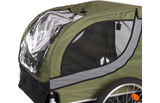 Groene fietskar met zwarte raamstrook en wit zijpaneel van mesh