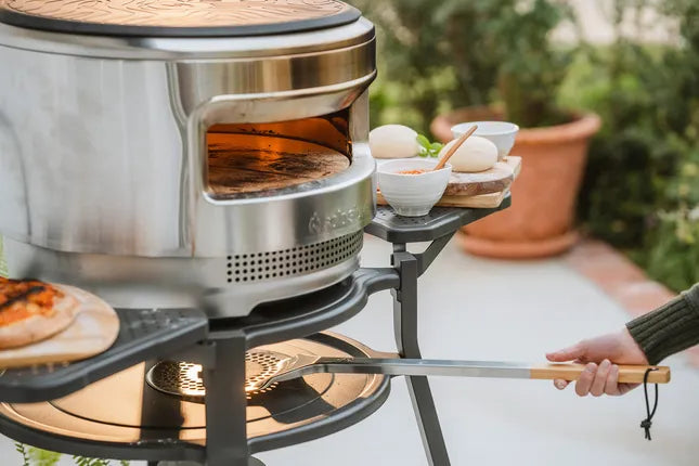 RVS pizzadraaier met houten handgreep en geperforeerde ronde kop