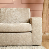 Beige stoffen bankdeel met hoge armleuning en brede zitting, afgeronde hoeken