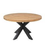 Ronde eettafel met houten blad en zwarte kruispoten onder het blad