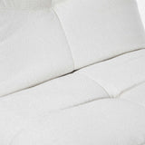 Relaxfauteuil Lazy lichtbeige zitkussen met naden en ingenaaide panelen.