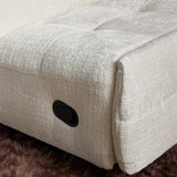 Gebroken witte fauteuilzitting met zwarte bedieningsknop en geweven stofstructuur.