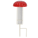 Vliegenzwam regenmeter met rode dop en meetbuis met schaalverdeling, staanders