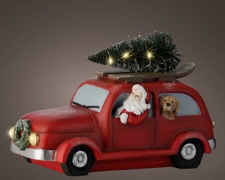 Polyresin kerstauto rood met kerstman en hond, met lichtjes en dennenkrans